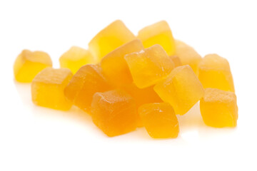 Micro close-up and details of Organic Indian yellow tutti frutti sweet soft candy  isolated over white background.