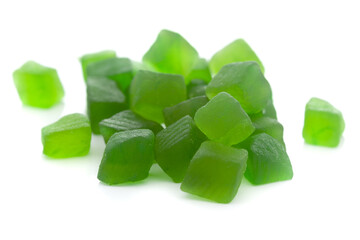 Micro close-up and details of Organic Indian green tutti frutti sweet soft candy  isolated over white background.