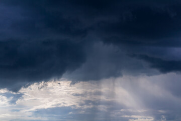 Dramatic storm cumulus cloud sky with rain