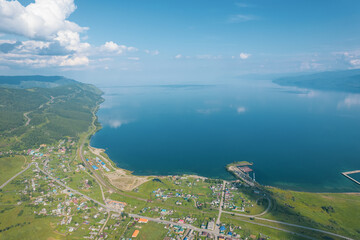 Summertime imagery of Lake Baikal is a rift lake located in southern Siberia, Russia Baikal lake summer landscape view from a cliff near Grandma's Bay. Drone's Eye View.