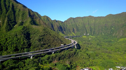 Hawaiian island road mountains sky rocks trees