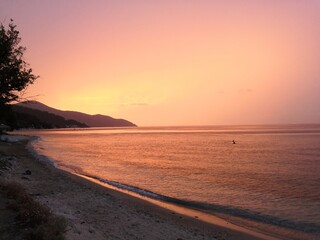 Beautiful colorful sunset at greek beach