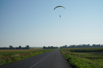 A paraglider flying thanks to the air currents. Extreme hobby.