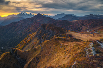 Fototapeta na wymiar Mountain ridges with beautiful peaks at sunset, Dolomites, Italy