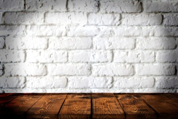 Background wooden table and white brick wall in the background, empty brown wooden table top for displaying products in the kitchen, shop, shop, cafe and restaurant, wooden table top, counter