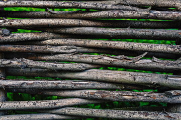 wicker fence texture. wattled rods background - obrazy, fototapety, plakaty