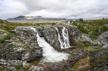Fototapeta na wymiar The Storulfossen Waterfall in the Rondane National Park in Norway.