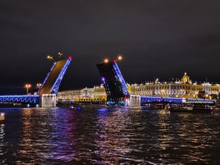 Fototapeta na wymiar Raised night Palace bridge in St. Petersburg
