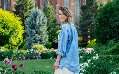 Fototapeta premium Caucasian young woman in spring time garden