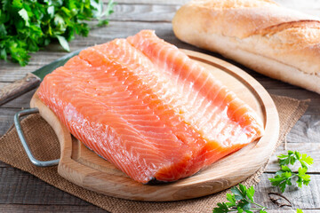 Raw fillets of red fish on table, salmon, cooking healthy diet dishes for dinner