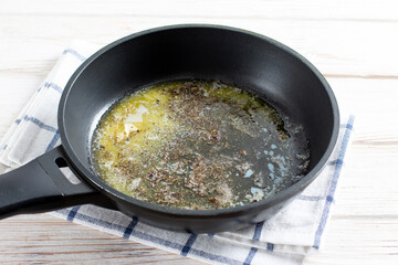 Butter in a skillet with spices. Sauce for making pumpkin gnocchi. Step by step.