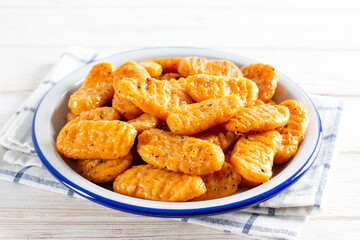 Delicious pumpkin gnocchi with olive oil, vegan food.