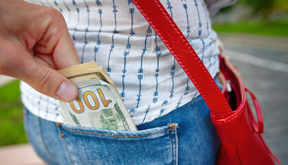 Pickpocketing, offender stealing cash from back pocket in the street. Stealing money, street...