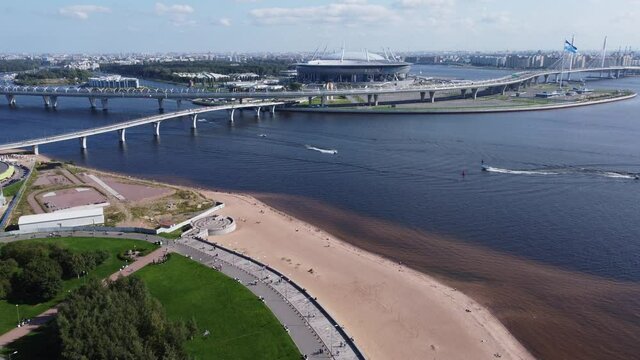 Gazprom Arena (Krestovsky Stadium) and the beach of the Gulf of Finland near the park of the 300th anniversary of Saint Petersburg