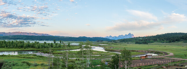 Panorama of Buffalo Fork River Valley in Morning Light with Mist on the River and the Grand Teton Mountains in the Background