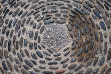Pebbles stone road texture Ancient paving stone background