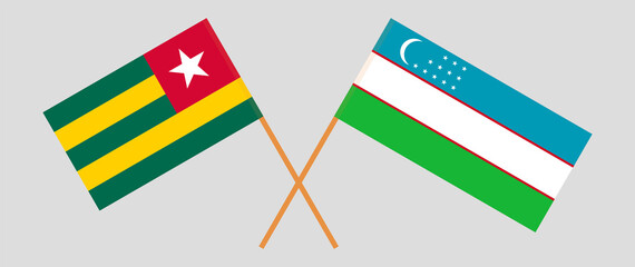 Crossed flags of Togo and Uzbekistan. Official colors. Correct proportion