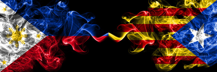 Philippines, Filipino vs Catalonia, Catalan, Catalonian, Spain smoke flags side by side.