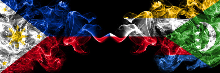 Philippines, Filipino vs Comoros, Comorian smoke flags side by side.