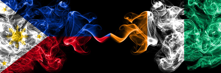 Philippines, Filipino vs Ivory Coast smoke flags side by side. © Vlad