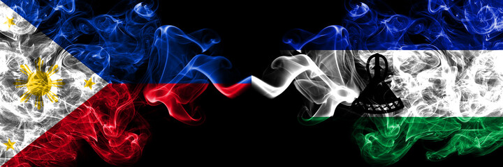 Philippines, Filipino vs Lesotho smoke flags side by side.