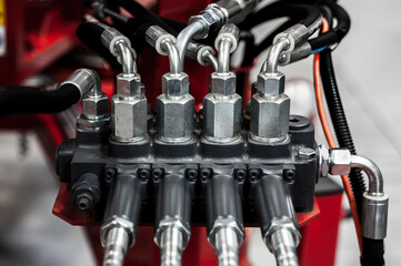 Close-up of industiral machine distributor. Wires and pipes.