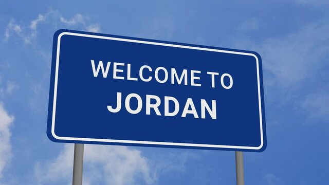 Welcome to Jordan Road Sign on Clear Blue Sky with Rapid Moving Clouds