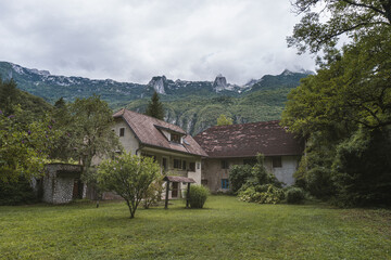 Old house in the mountains. Magnificent landscape view with mountain house. Location Bovec, National Park Triglav, Slovenia, Europe. Traveling concept background. 