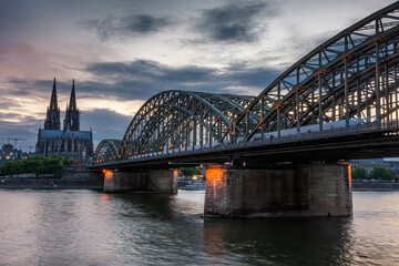 COLOGNE, GERMANY, 23 JULY 2020 Colorful sunset over Cologne Cathedral and Hohenzollern Bridge