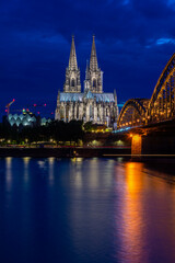 COLOGNE, GERMANY, 23 JULY 2020 Night view of Cologne Cathedral and Hohenzollern Bridge