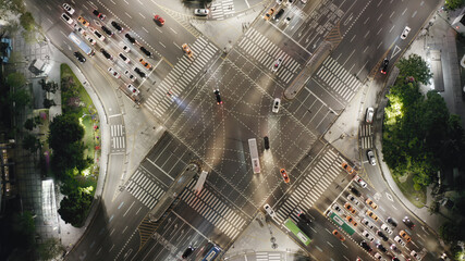 Beautiful aerial view to a crossroad in Seoul Gangnam District on the evening. Cars, buses and...