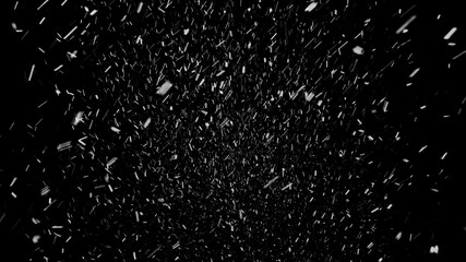 Beautiful snow falling softly from the sky, isolated on the black background. Light atmospheric...