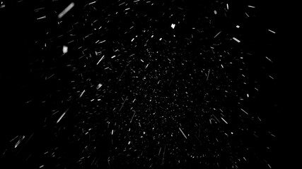 Beautiful snow falling softly from the sky, isolated on the black background. Light atmospheric...