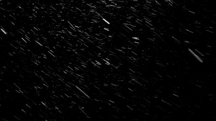 Beautiful atmospheric blizzard with small snowflakes rushing in different directions and constantly changing their way because of the wind. isolated on the black background.