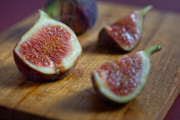 Sliced fig on a wooden cutting board