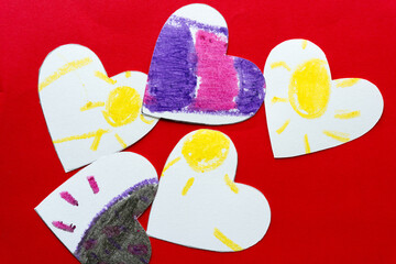 sunshine and unhappy hearts on red