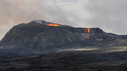 Beautiful aerial view of the Active Volcano with red Lava in Iceland