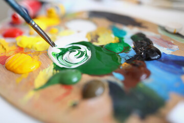 The palette contains a mixture paints for painting