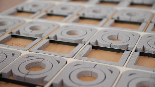 Flat die cutting and folding template tool for the packaging industry - close up, camera slide above