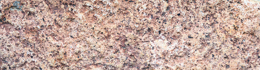 Closeup of rough textured rock as an abstract natural background
