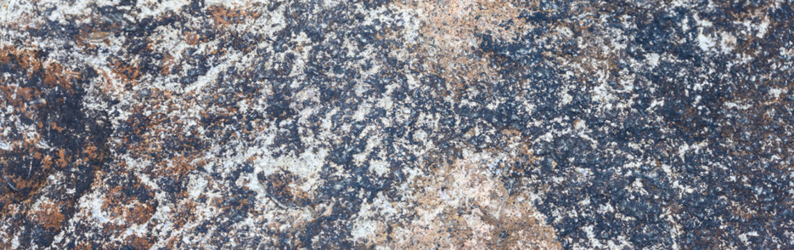 Closeup of rough textured rock as an abstract natural background © knelson20