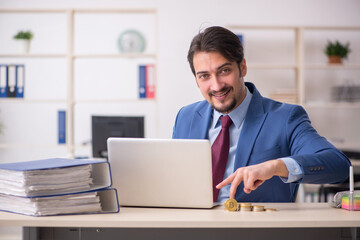 Young man earning money via Internet in cryptocurrency concept