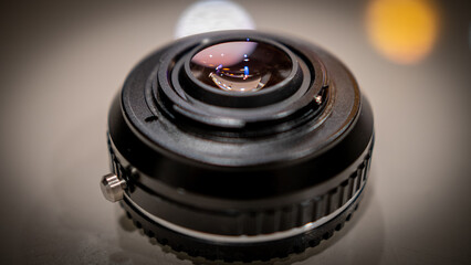 Fototapeta na wymiar Lens adapter with its glass glare