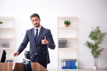 Young male employee working in the office