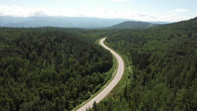 Winding road in the West Siberian taiga ecoregion