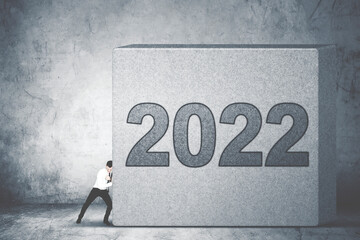 Caucasian businessman pushes 2022 numbers