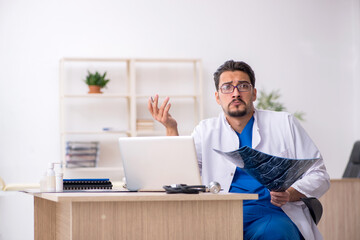 Young male doctor radiologist working in the clinic