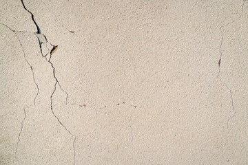 Beige rustic wall cracked on few places texture 