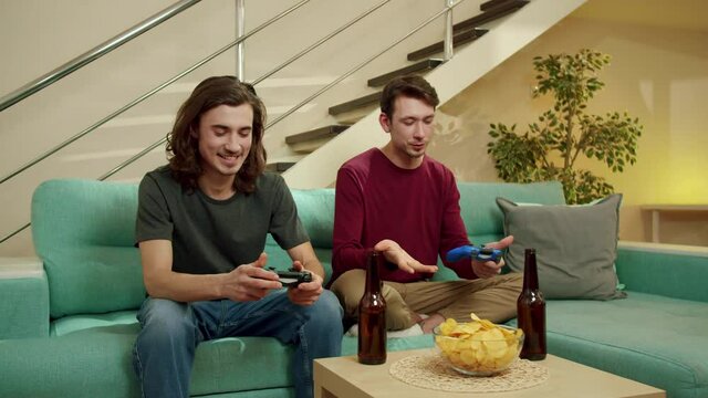 Two friends are playing games and laughing 