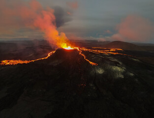 Beautiful aerial cinematic footage of the bowling lava exploding from the Active Volcano in Iceland